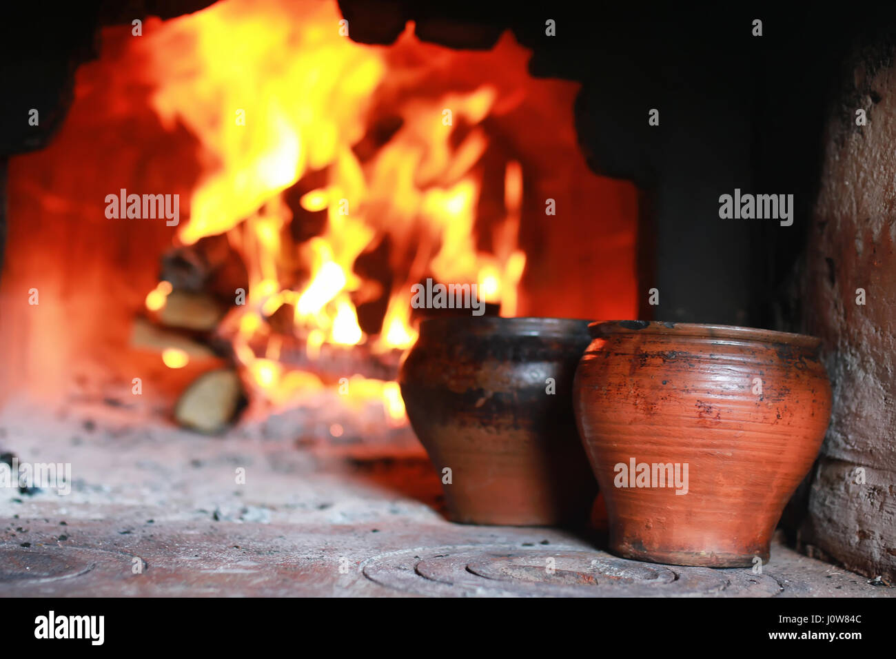 pot in the oven with food the oven fork Stock Photo Alamy