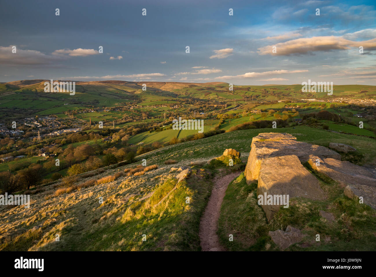 View from the rocky summit of Eccles Pike in the Peak District, Derbyshire, England. A lovely spring evening with view towards Chinley. Stock Photo