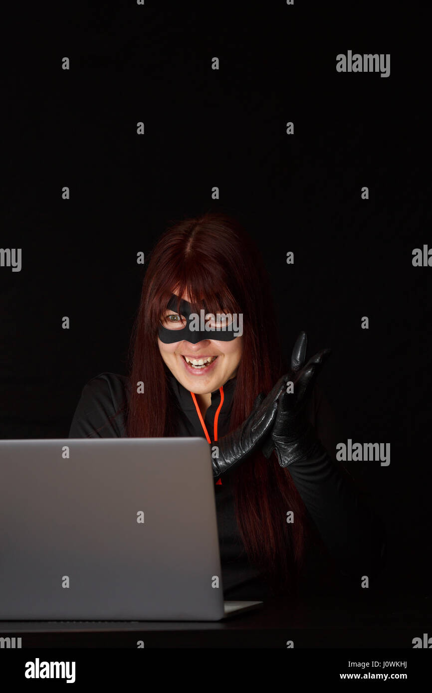 Female hacker in black mask hires stock photography and images Alamy