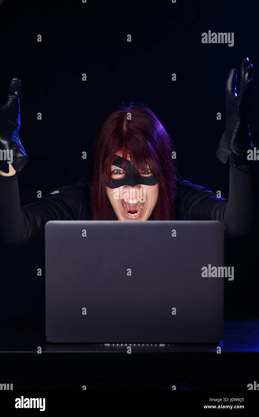 Photo of hacker with computer Stock Photo - Alamy