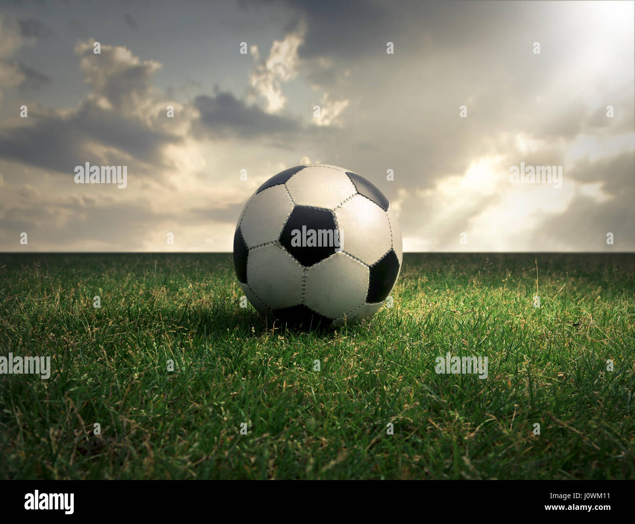 Soccer ball on field Stock Photo