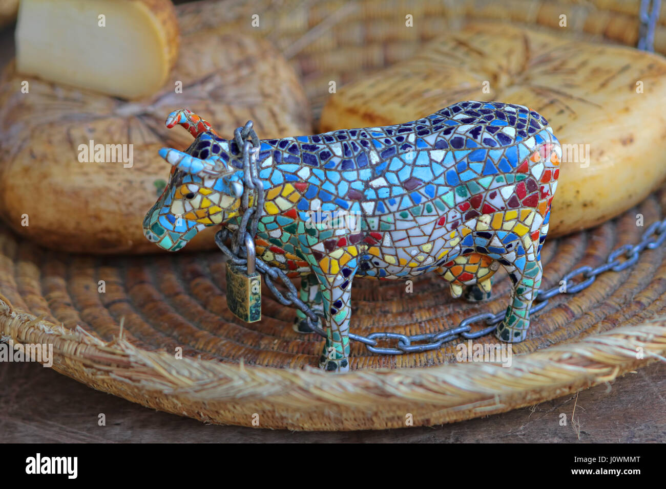Miniature ceramic multicoloured mosaic statue of bull traditional