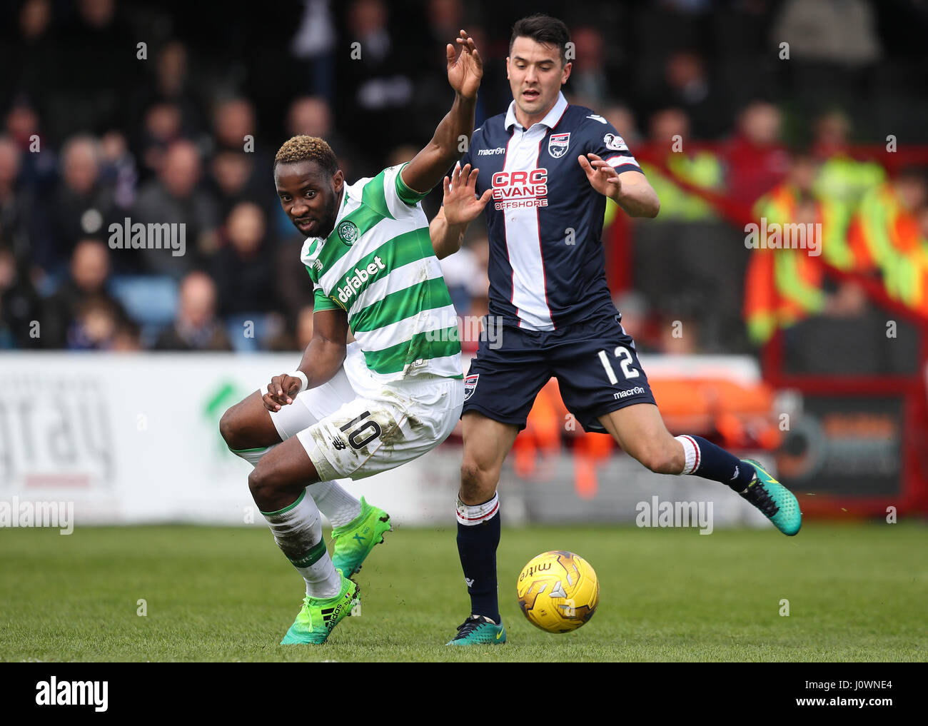 Celtic's Moussa Dembele ans Ross County's Tim Chow battle for the ball during the Ladbrokes Scottish Premiership match at the Global Energy Stadium, Dingwall. Stock Photo
