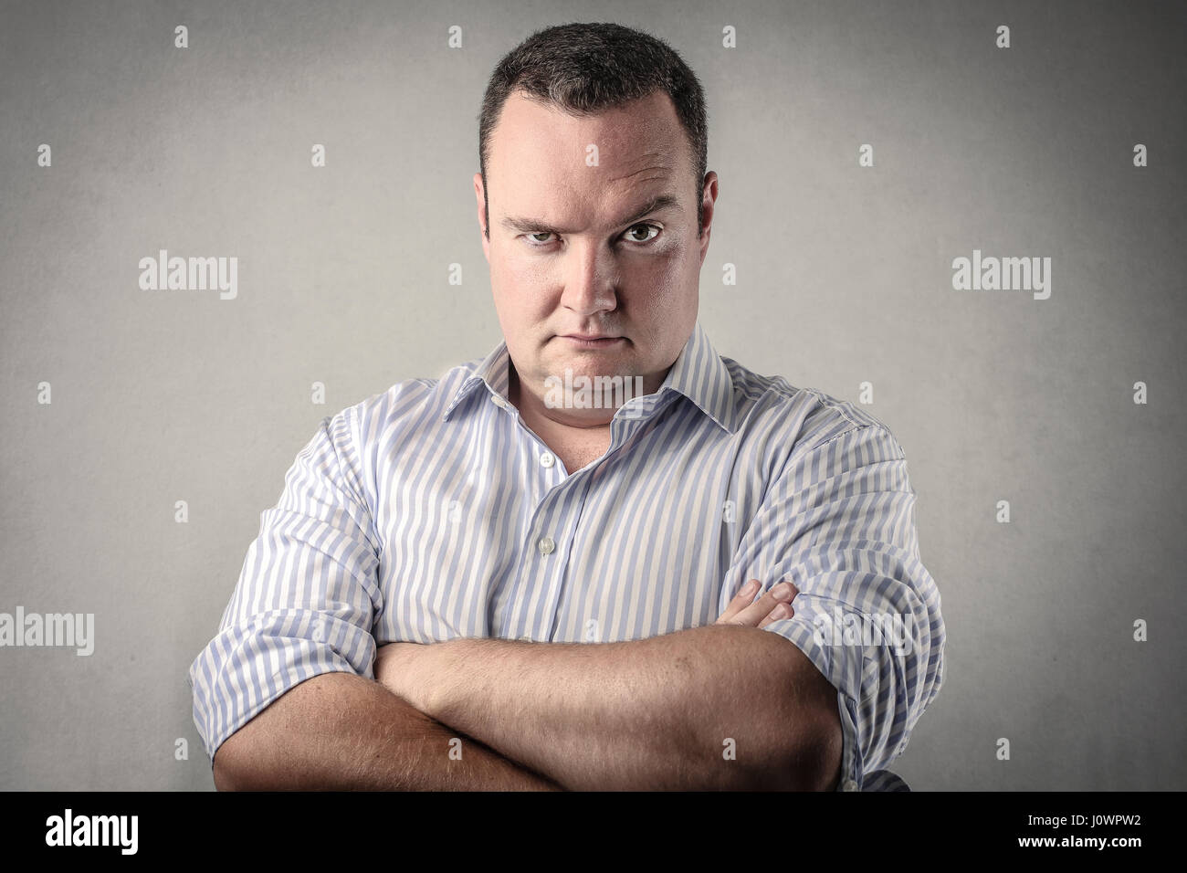 Fat man looking serious Stock Photo