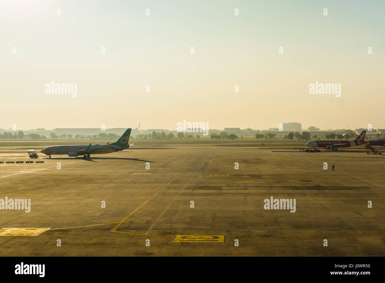 Bangkok, Thailand - March 19, 2017: Don Muang International Airport. Parking Airplanes at airport during boarding operations. They are few planes on a Stock Photo