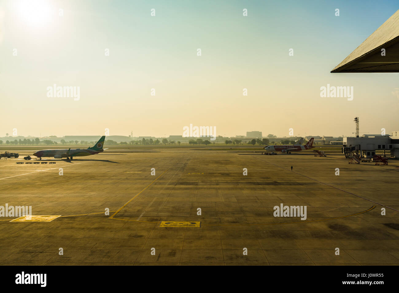 Bangkok, Thailand - March 19, 2017: Don Muang International Airport. Parking Airplanes at airport during boarding operations. They are few planes on a Stock Photo