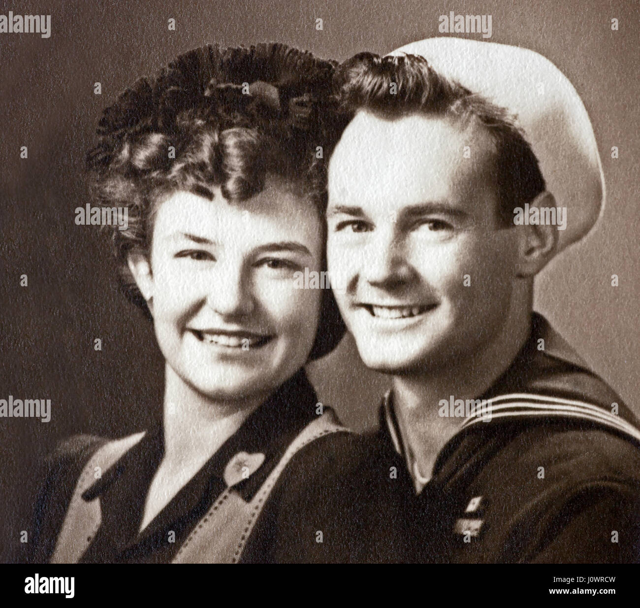 Vintage 1943 black and white photo of a World War II U.S. Navy sailor and his fiancee in Massachusetts, United States. Stock Photo
