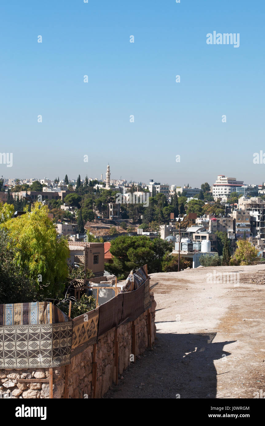 Jordan: the skyline of Amman, the capital and most populous city of the Hashemite Kingdom of Jordan, with the buildings, the palaces and the houses Stock Photo