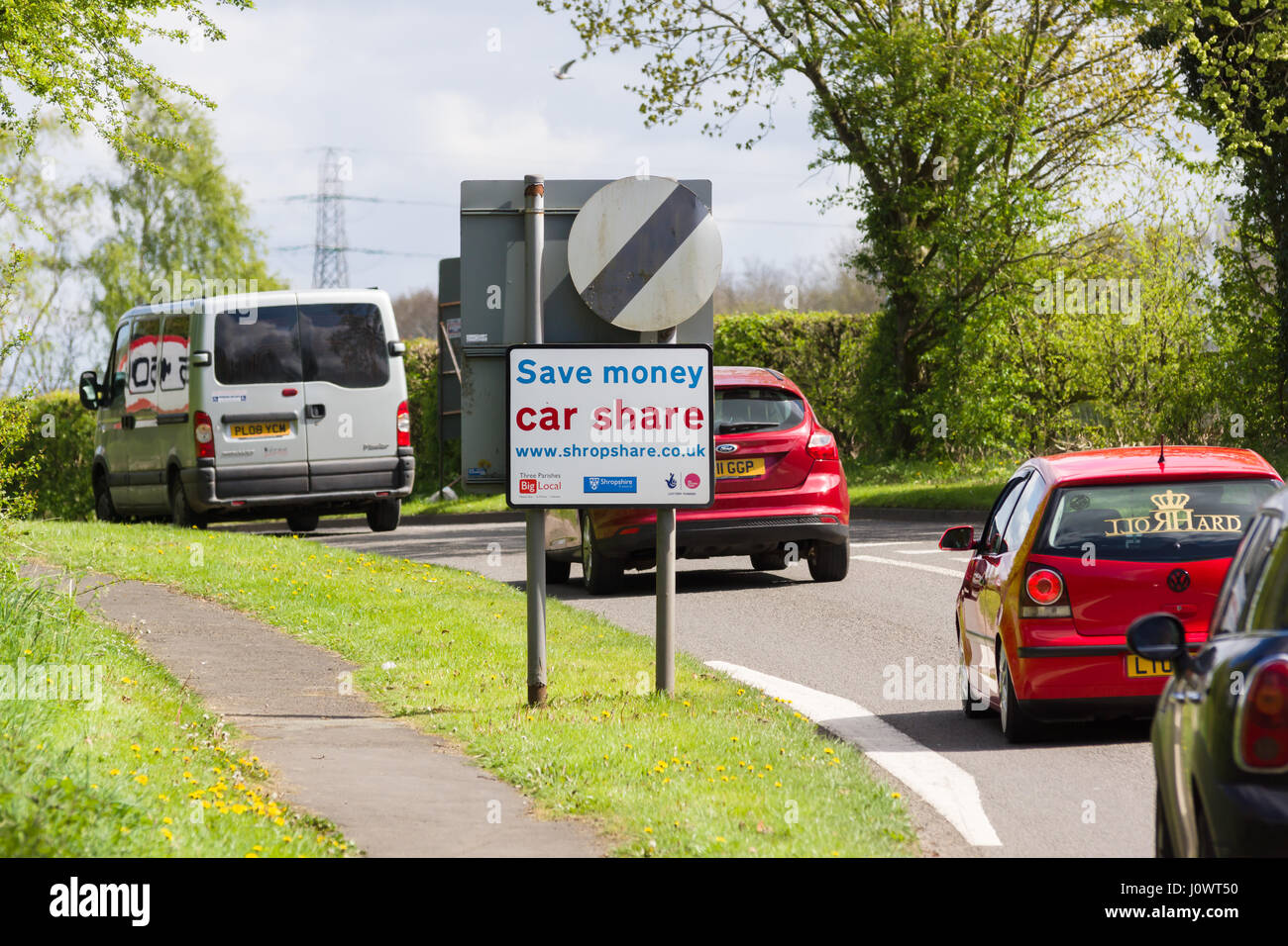 Roadside sign erected by Shropshare Carshare Shropshire and Telford advising drivers of car sharing or pooling to save money and running costs Stock Photo