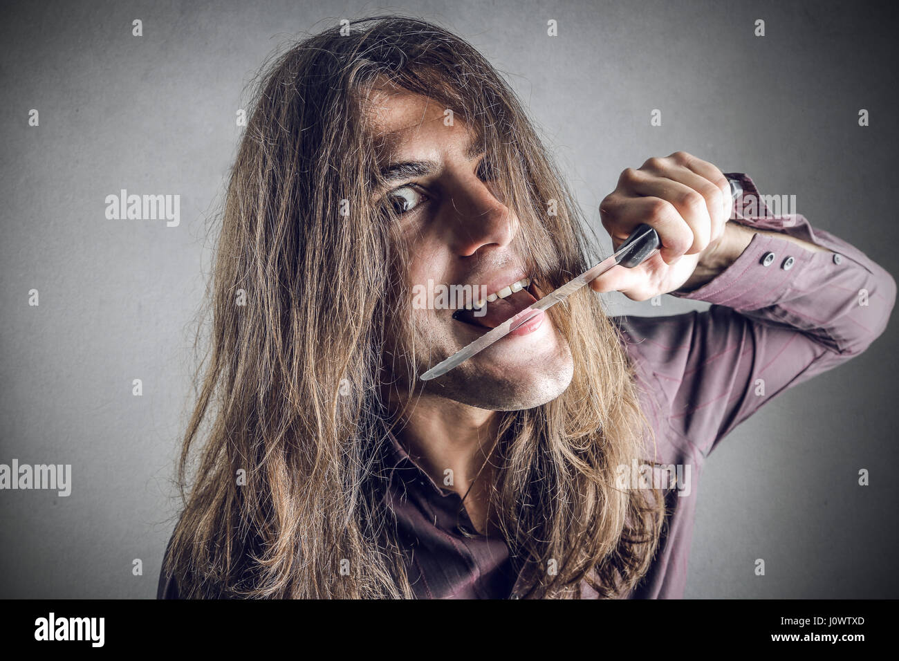 Crazy man with knife Stock Photo