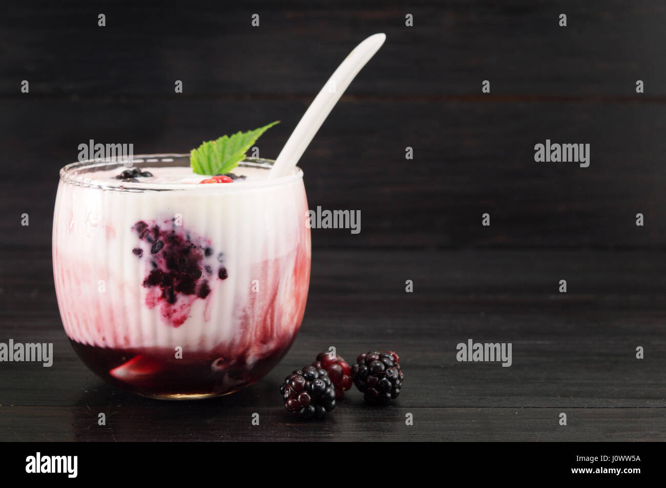 Homemade blackberry parfait served in a glass Stock Photo
