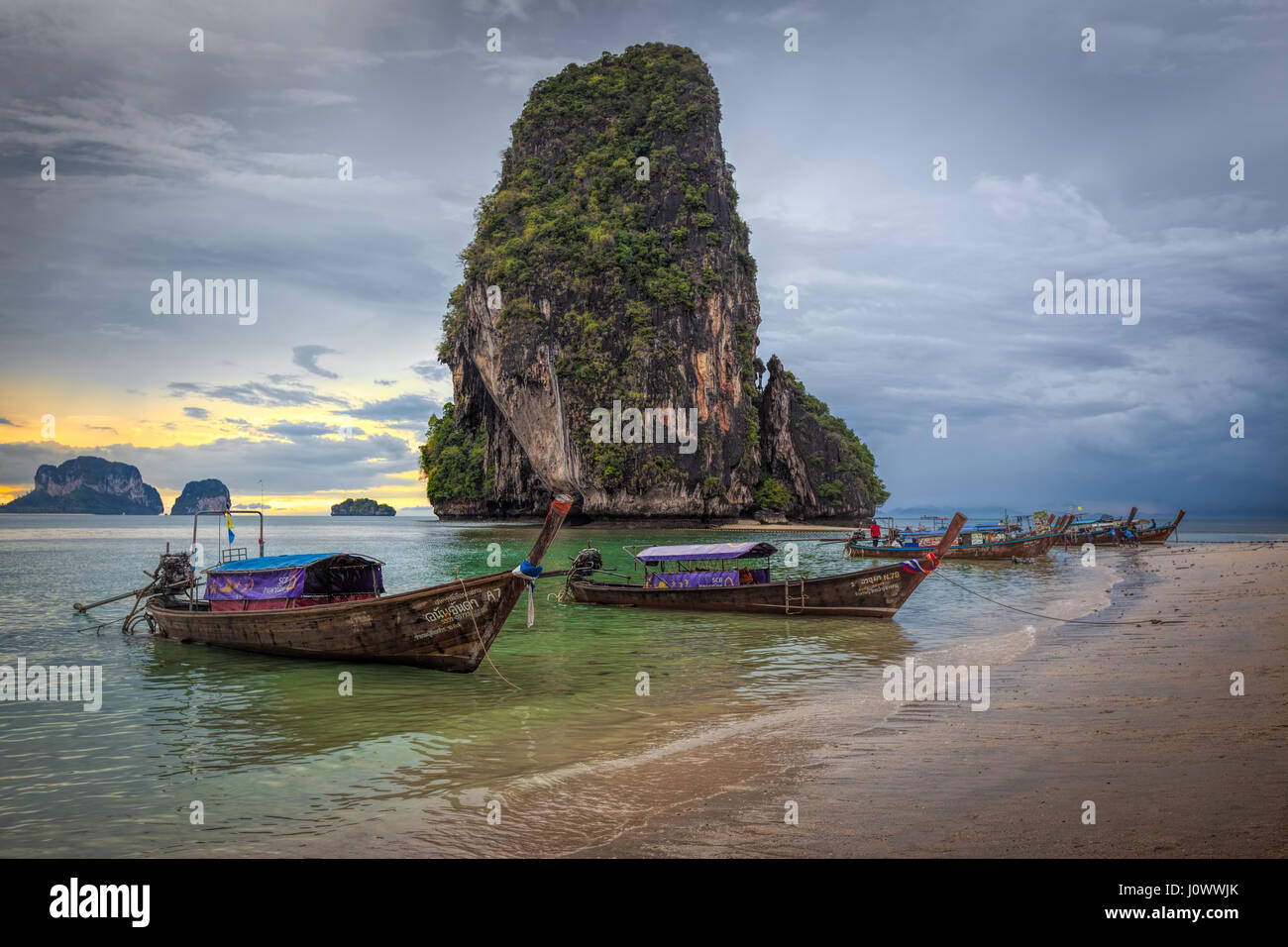Phra Nang beach, Railay, Krabi province, Thailand: longtail boats in front of Happy Island Stock Photo