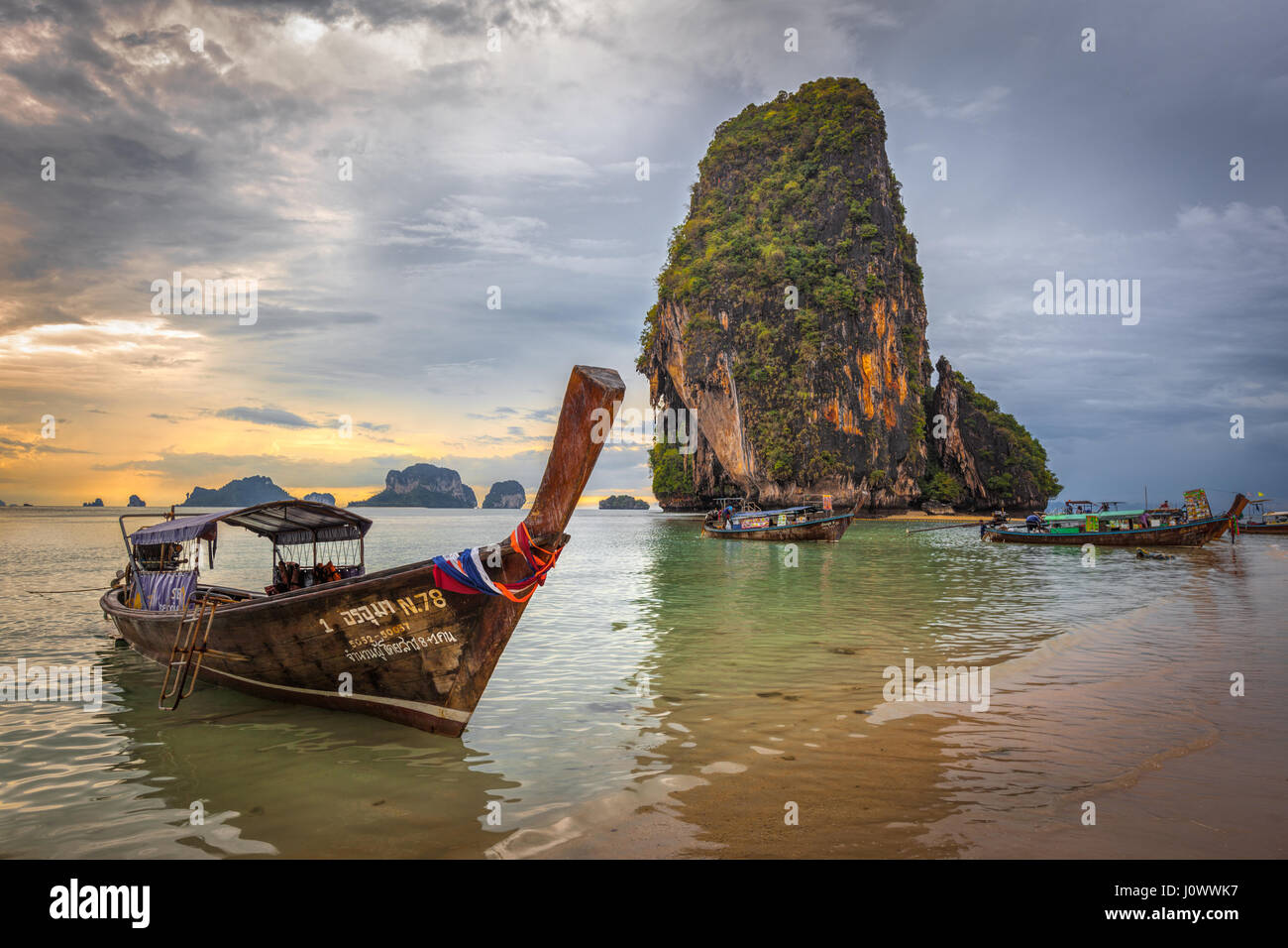 Phra Nang beach, Railay, Krabi province, Thailand: longtail boats in front of Happy Island Stock Photo