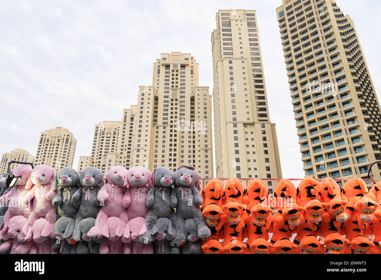 Dubai - January 30: View of Dubai Marina skyscrapers and colorful stuffed animal toys on January 30, 2017. Stock Photo