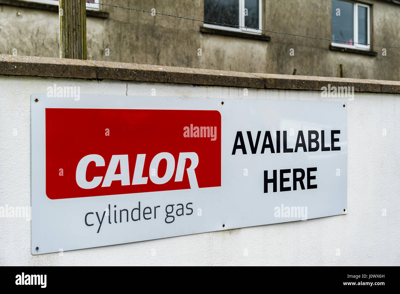 Calor cylinder gas available here for sale metal sign on a white wall with copy space. Stock Photo