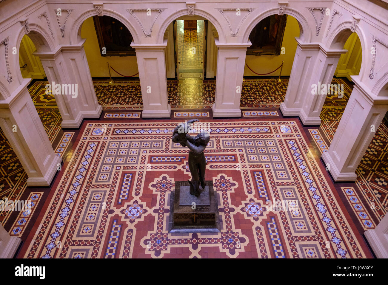 Osgoode Hall rotunda, view from above, Cleeve Horne statue, The World War Two memorial, colourful floor tiles, Atrium, Toronto, Ontario, Canada. Stock Photo