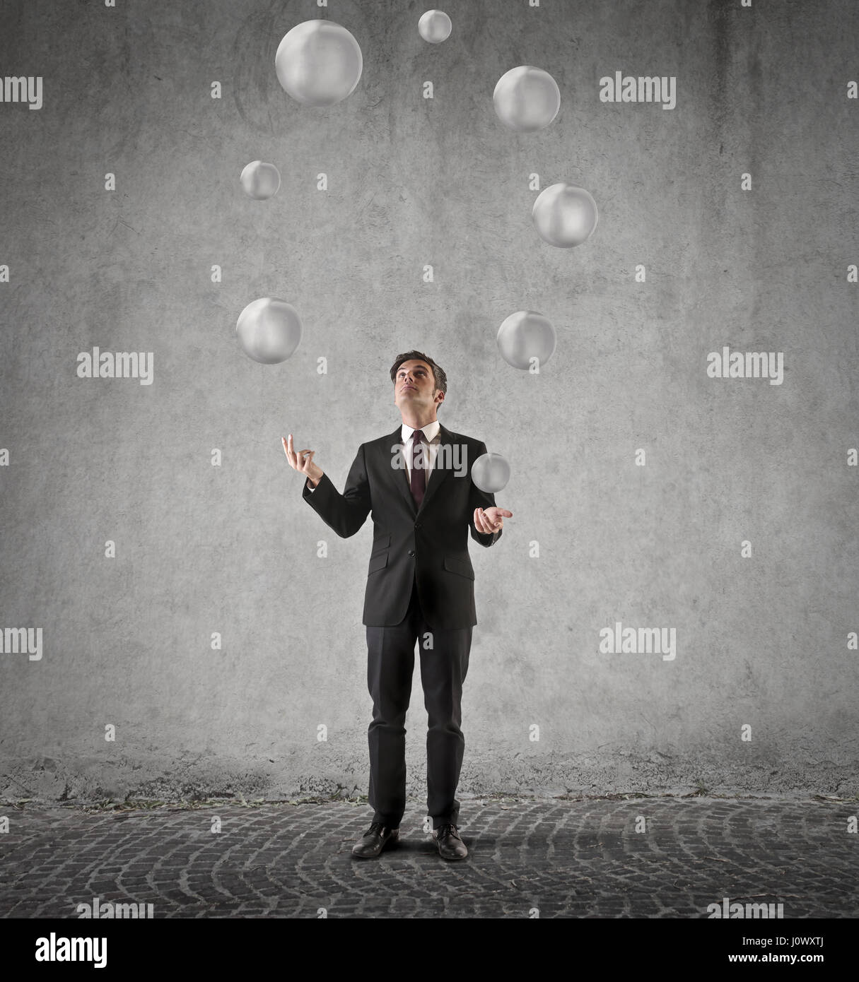 Businessman juggling with balls Stock Photo Alamy