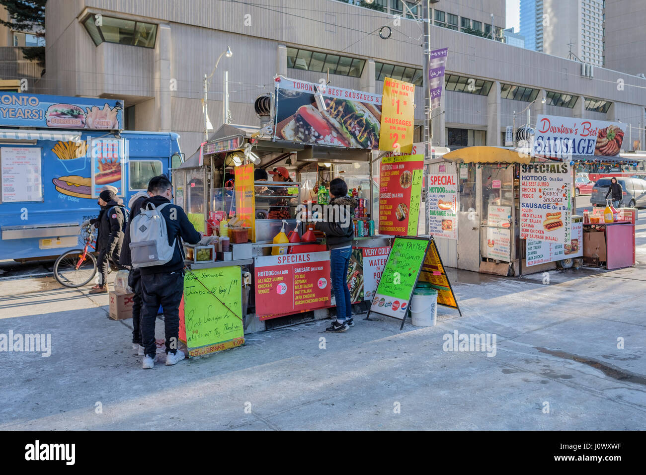 Street food vendors, carts, selling hot-dogs and sausage sandwiches at Queen Street, Nathan Phillips Square, in downtown Toronto, Ontario, Canada. Stock Photo