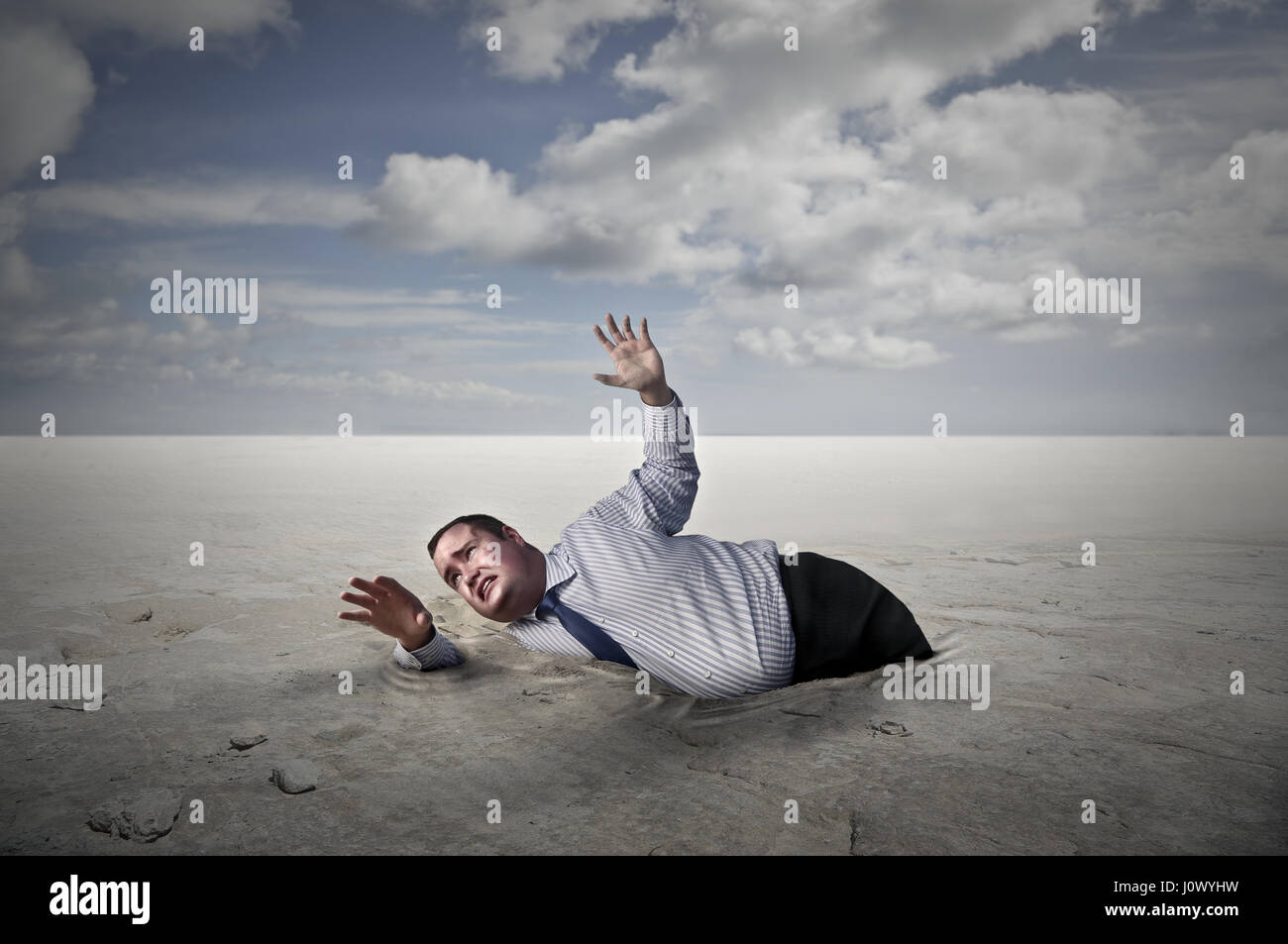 Man Sinking In Quicksand Stock Photos Man Sinking In
