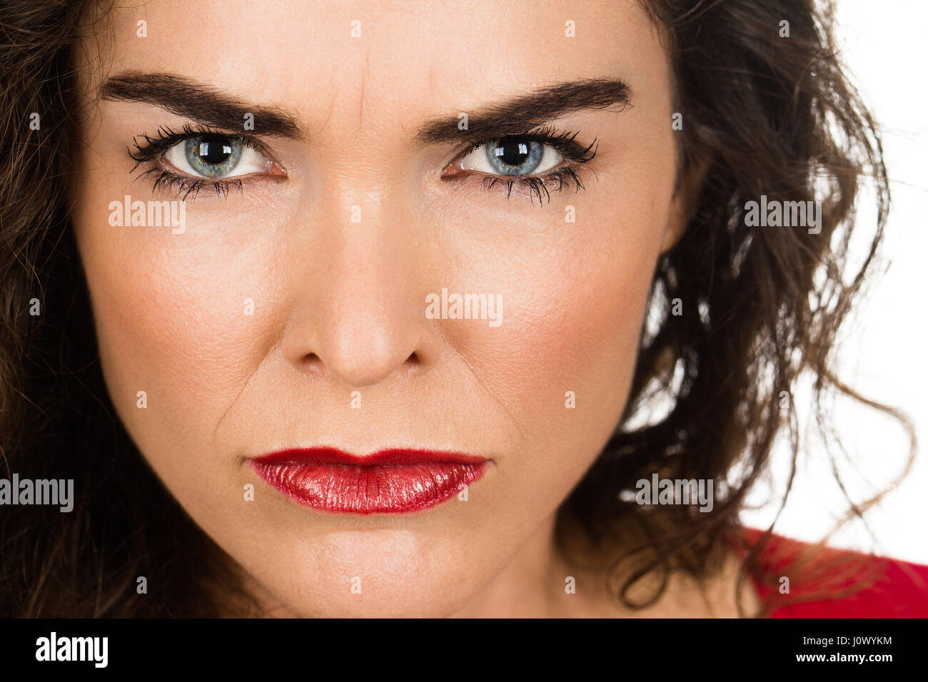 A very annoyed angry and woman. Isolated on white. Stock Photo