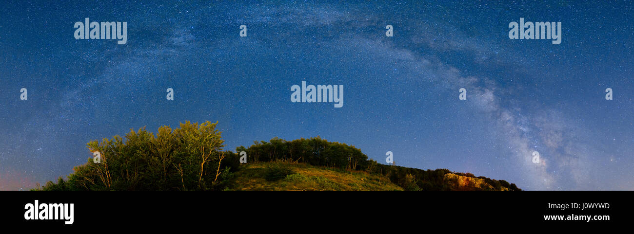The starry sky and the Milky Way over the mountains and the fore Stock ...