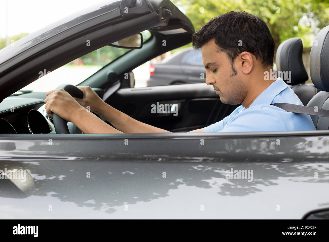 Closeup portrait tired young handsome man with short attention span