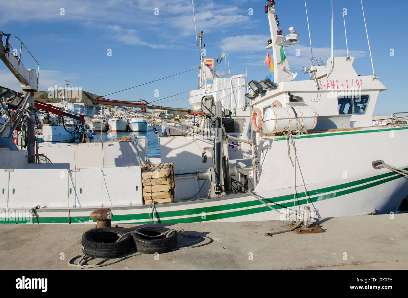 A green boat view in the Carboneras port, Almería province, Spain. Stock Photo