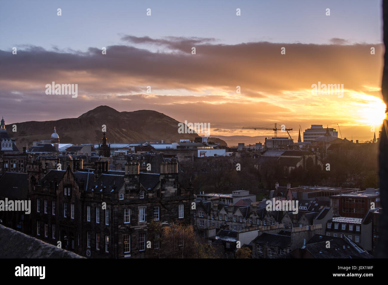 Sunrise over Edinburgh as seen from Edinburgh's Castle square Stock Photo