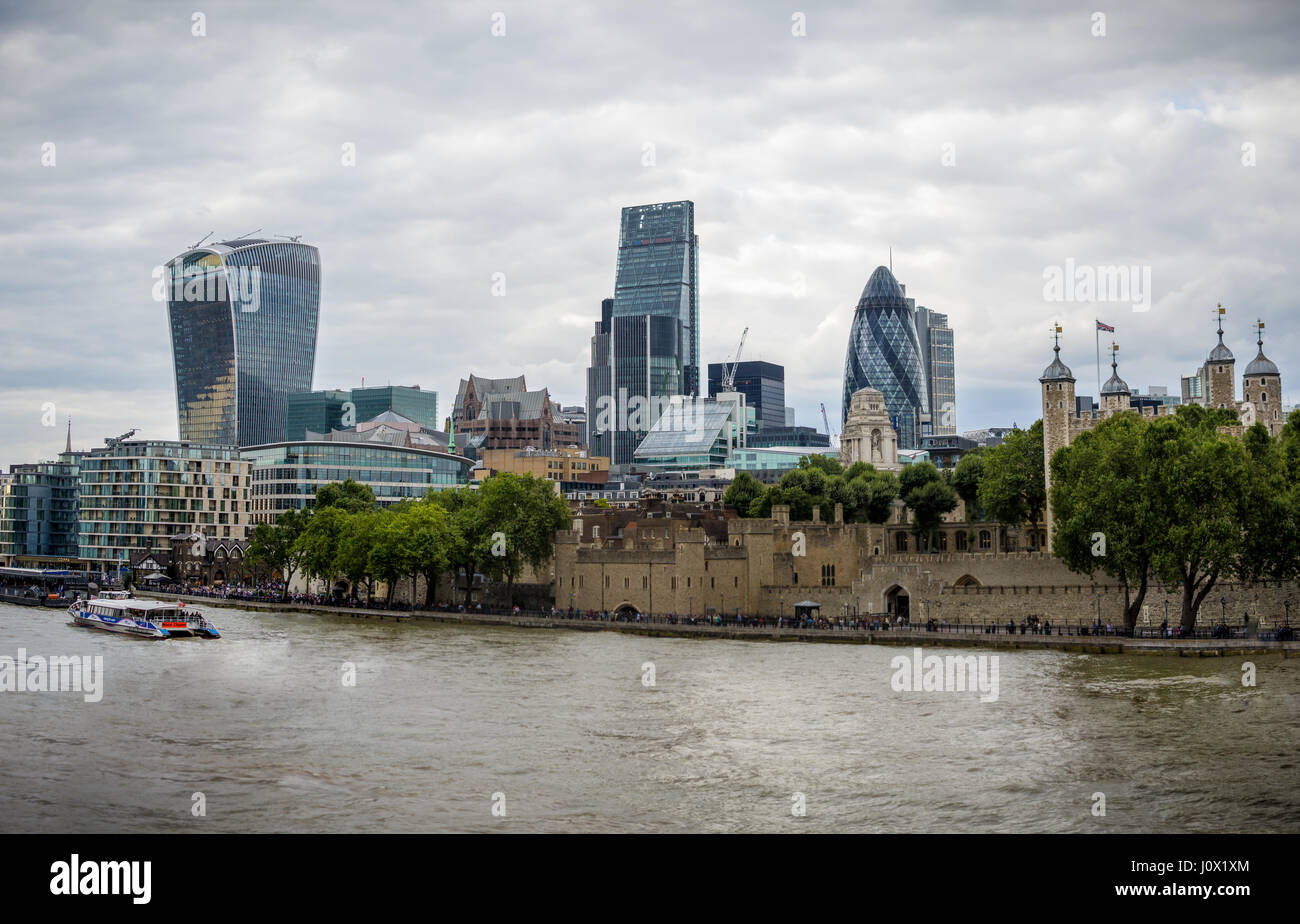 London, UK - August 8, 2016: The tower of London and skyscrapers in the City as seen from Tower Bridge Stock Photo