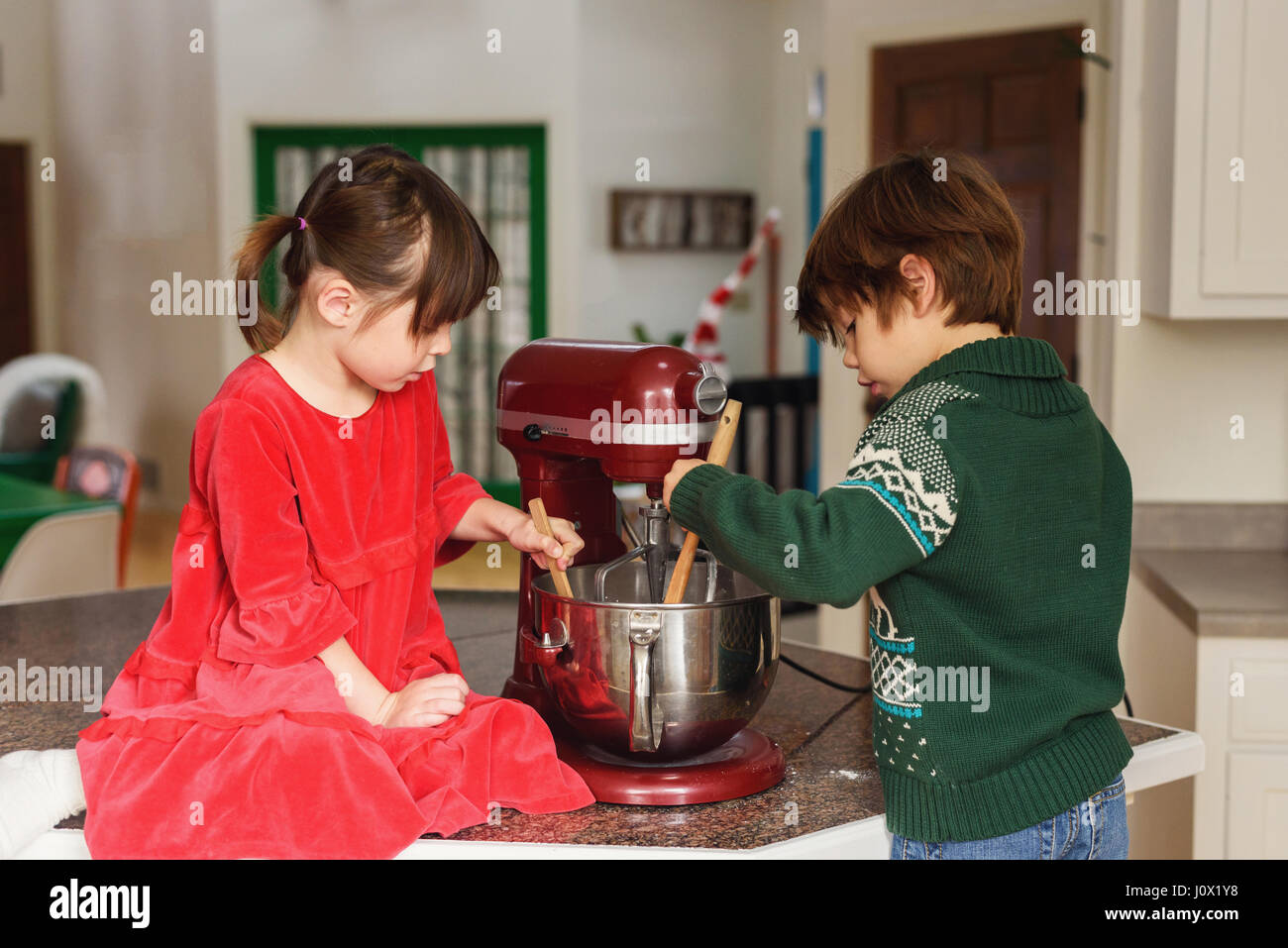 Two children baking cookies Stock Photo