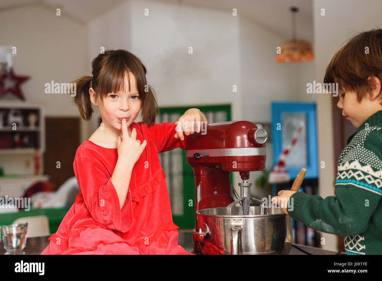 Two children baking cookies Stock Photo