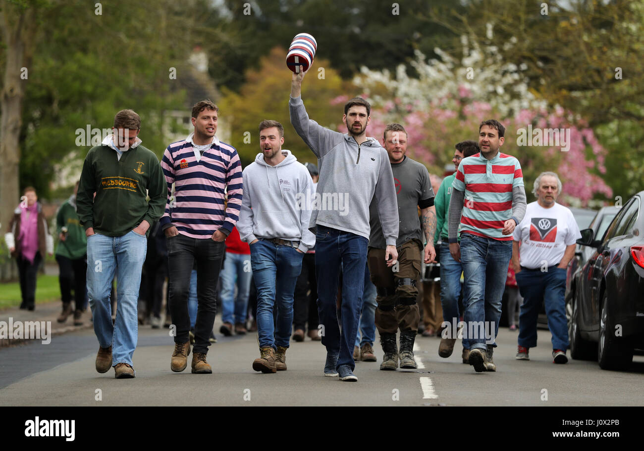 Villagers from Medbourne in Leicestershire parade a 'bottle' through the village before their annual bottle kicking match with neighbouring Hallaton. Stock Photo