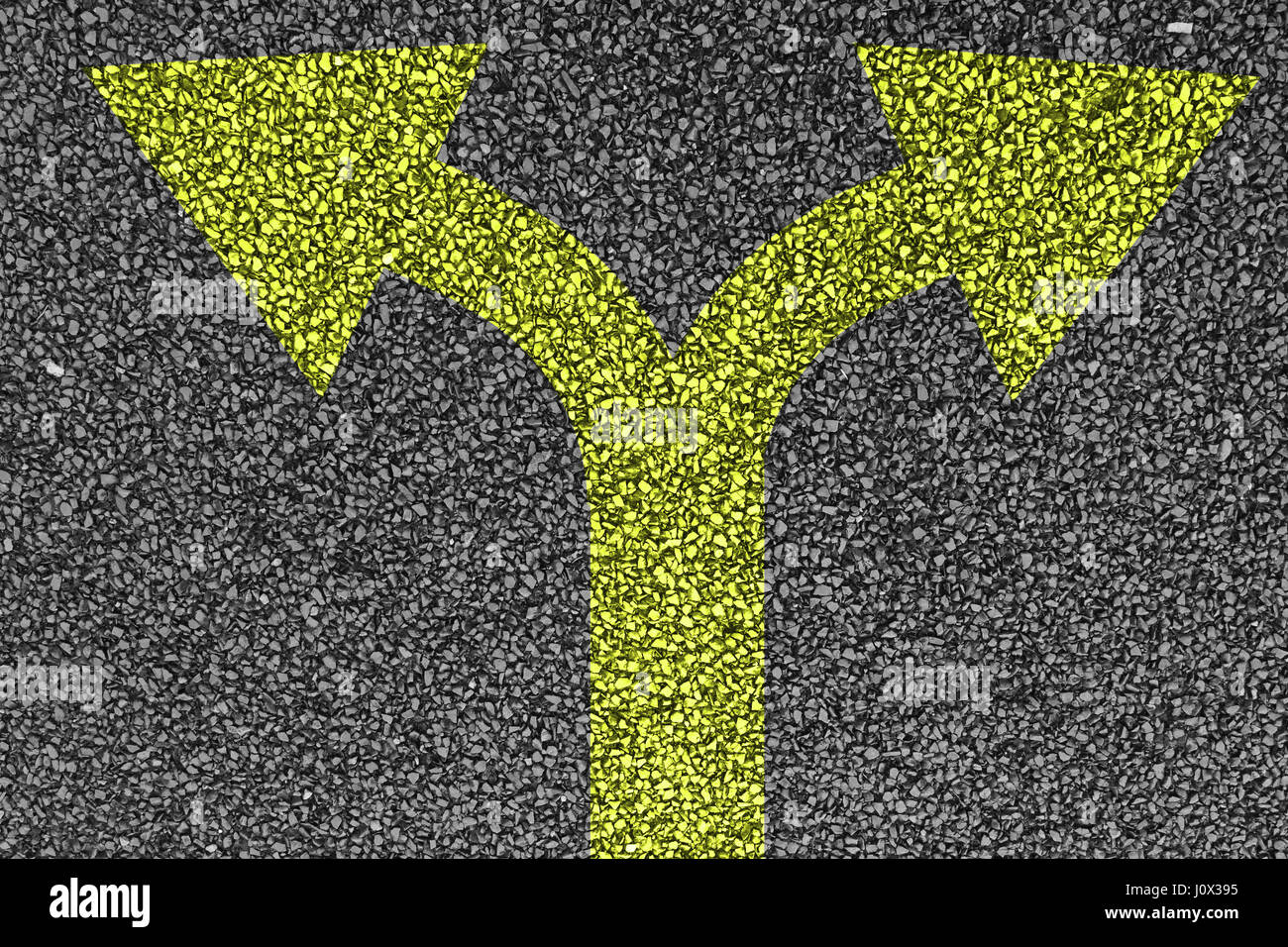 asphalt road and two painted yellow arrows Stock Photo - Alamy