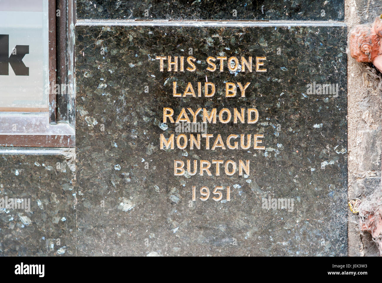 Motague Burton shop signs and foundation stones harking back to the era when the Burton shops were the height of mass market men's fashion Stock Photo