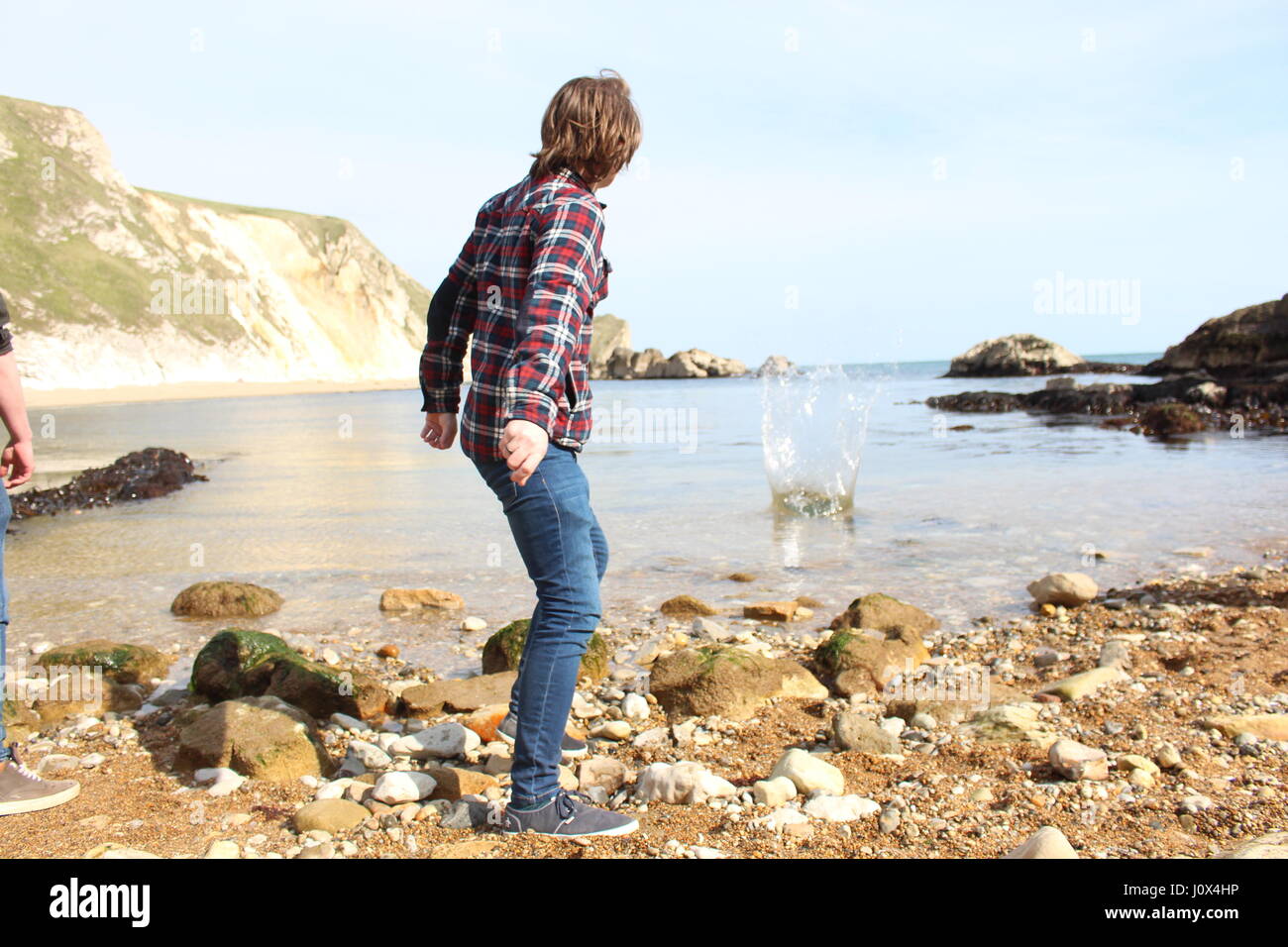 Skimming rocks at Durdle Door, Dorset Stock Photo Alamy