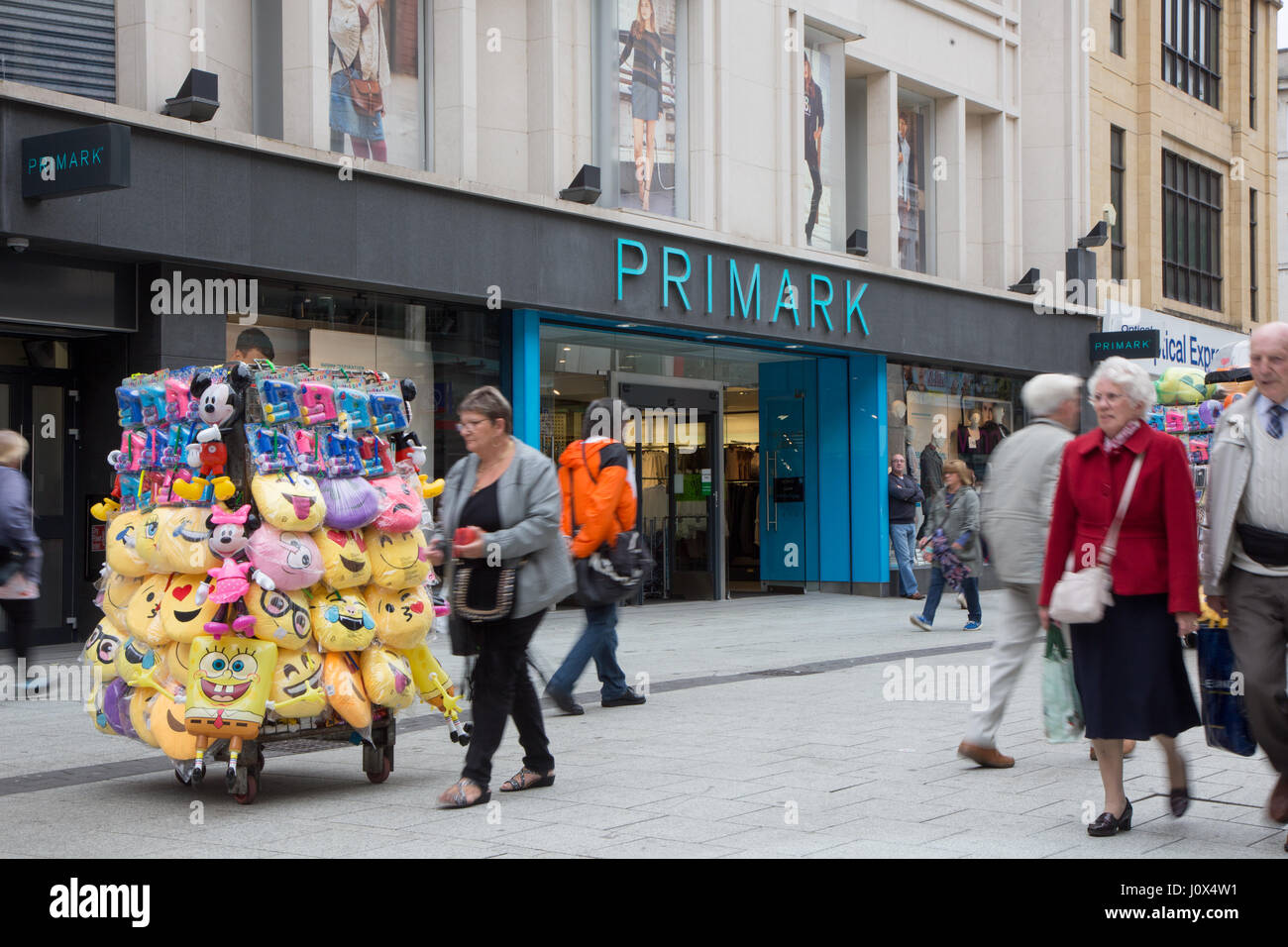 Primark on Queen Street, Cardiff. Vendors in the foreground are selling  emoji cushions etc Stock Photo - Alamy