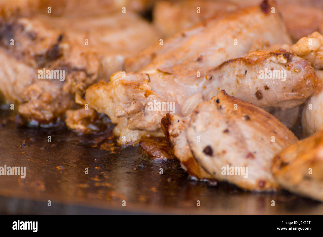 The meat is cooked in a cauldron Stock Photo - Alamy
