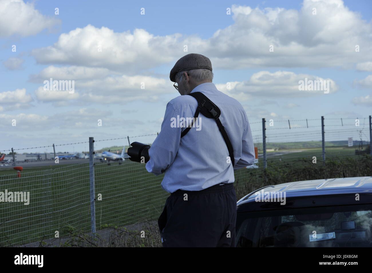plane spotter at bristol airport on a sunny afternoon Stock Photo