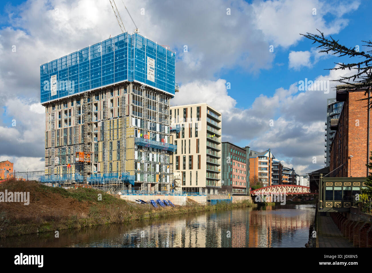 The 'Slate Yard' apartment block under construction, over the river