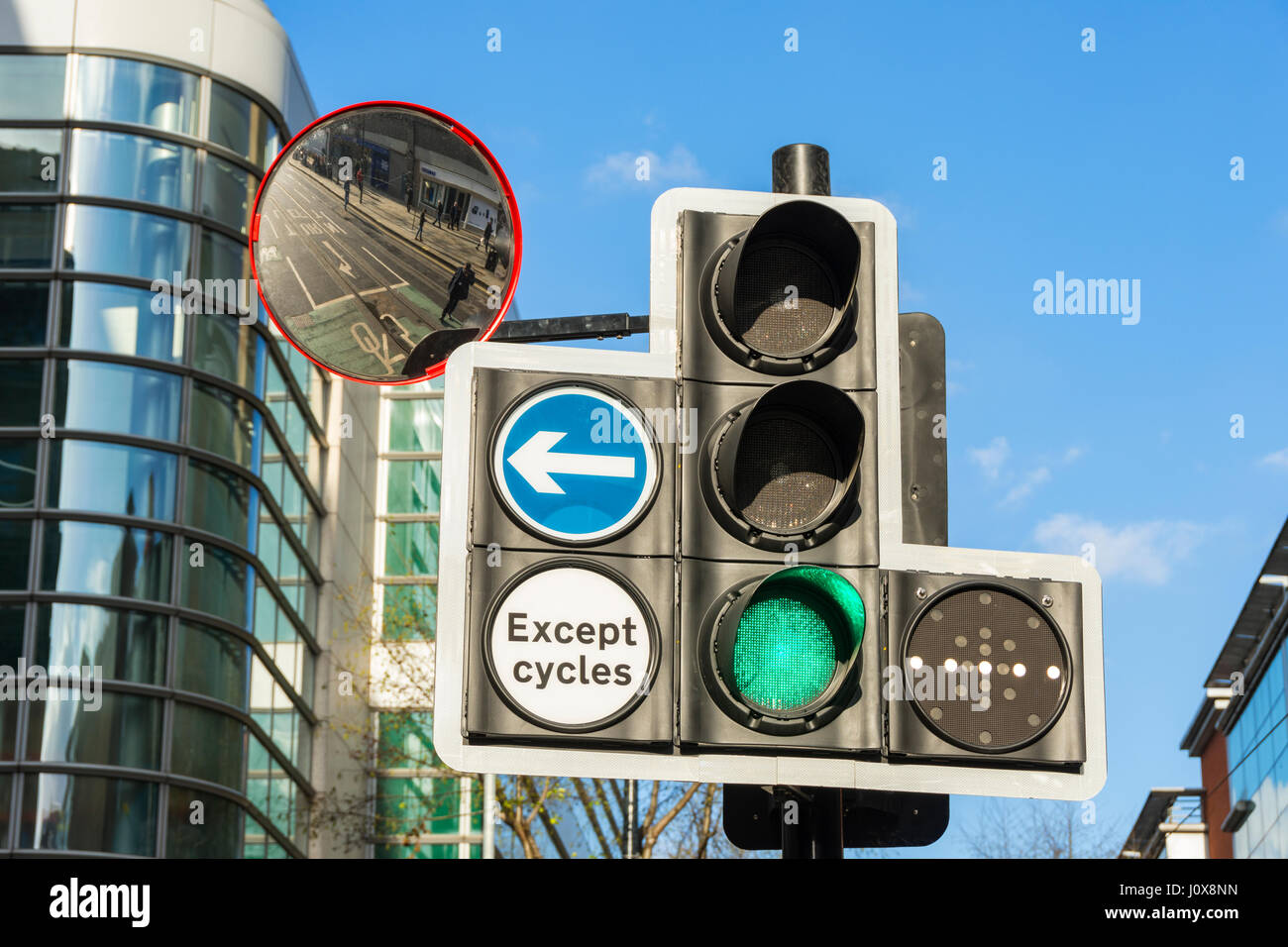 Traffic lights with tram signal and mirror, Cross Street, Manchester, England, UK Stock Photo