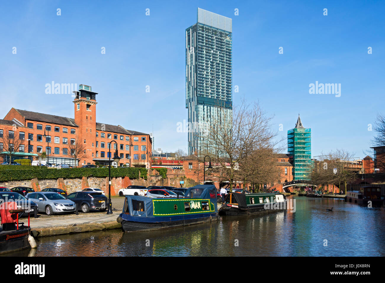 The Beetham Tower and narrowboats on the Bridgewater Canal at Castlefield, Manchester, England, UK. Stock Photo