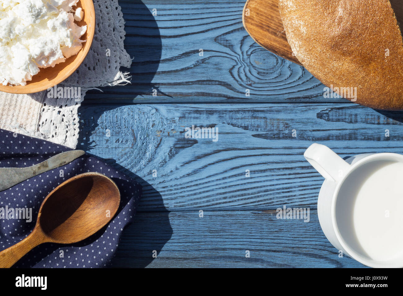 A Cup Of Milk Cottage Cheese And Bread On A Table Of Blue Boards