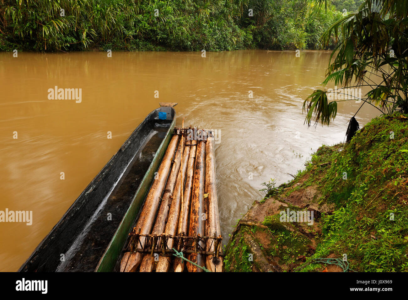 Wooden raft on a river in Ecuadorian Amazon Stock Photo