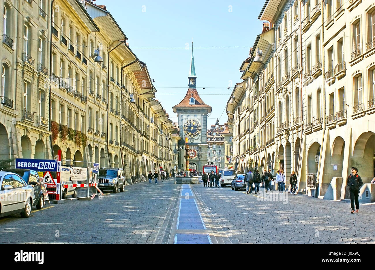 BERN, SWITZERLAND - MARCH 3, 2011: The walk along the medieval Kramgasse shopping street to the famous Zytglogge clock tower with preserved astronomic Stock Photo