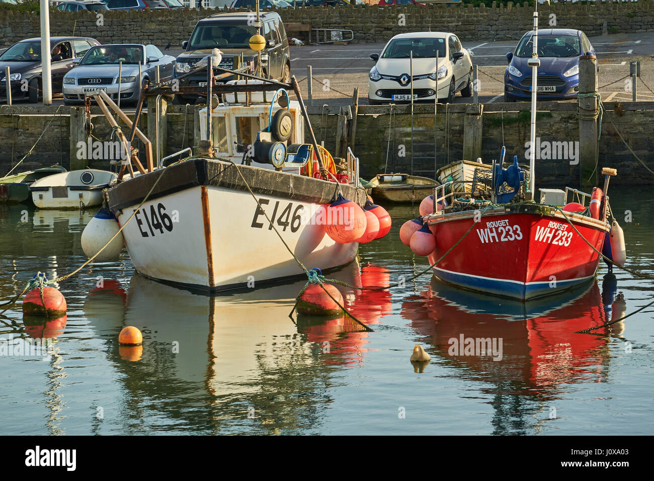 High tide, fishing boats and trawlers in the small seaside town of West