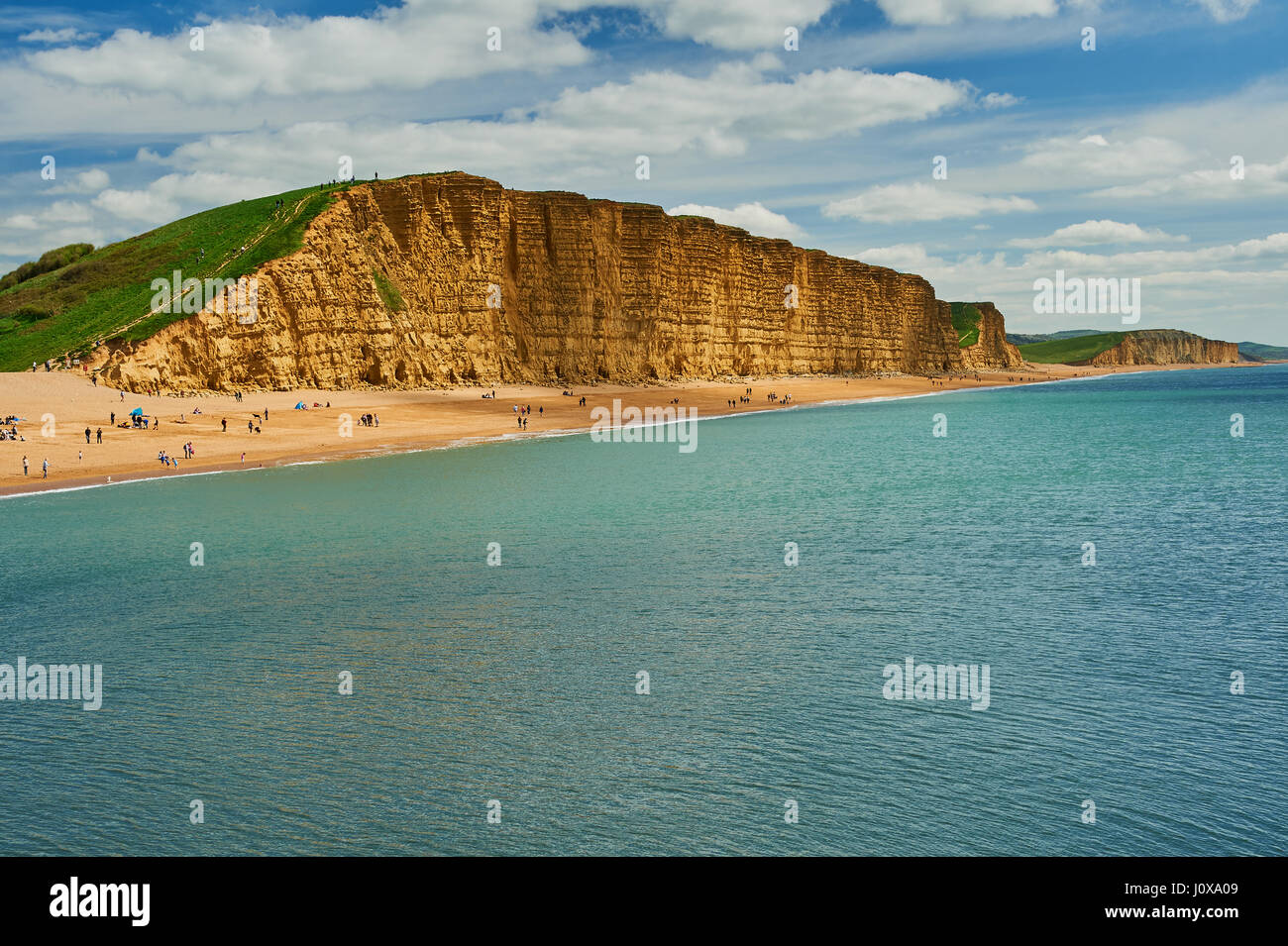 Sandstone cliffs of East cliff at the Dorset seaside town of West Bay. The iconic cliffs are on the Jurassic Coast and are some 150 million years old. Stock Photo