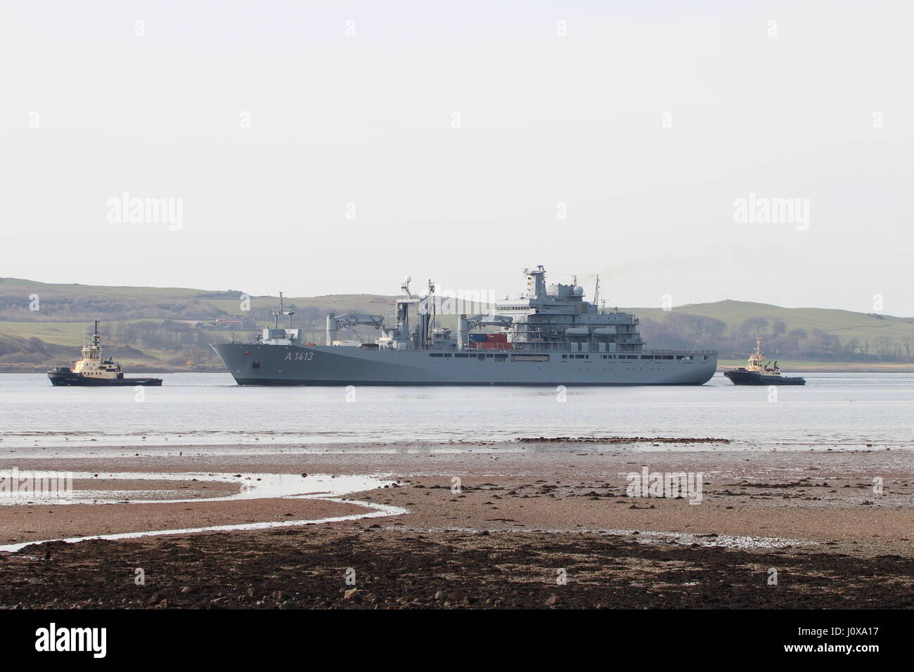 FGS Bonn (A1413), a Berlin-class replenishment vessel of the German Navy, being escorted into Hunterston during Exercise Joint Warrior 17-1. Stock Photo