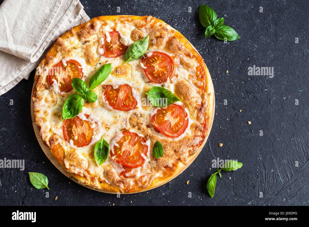 Pizza Margherita On Black Stone Background Pizza Margarita With Tomatoes Basil And Mozzarella Cheese With Copy Space Stock Photo Alamy
