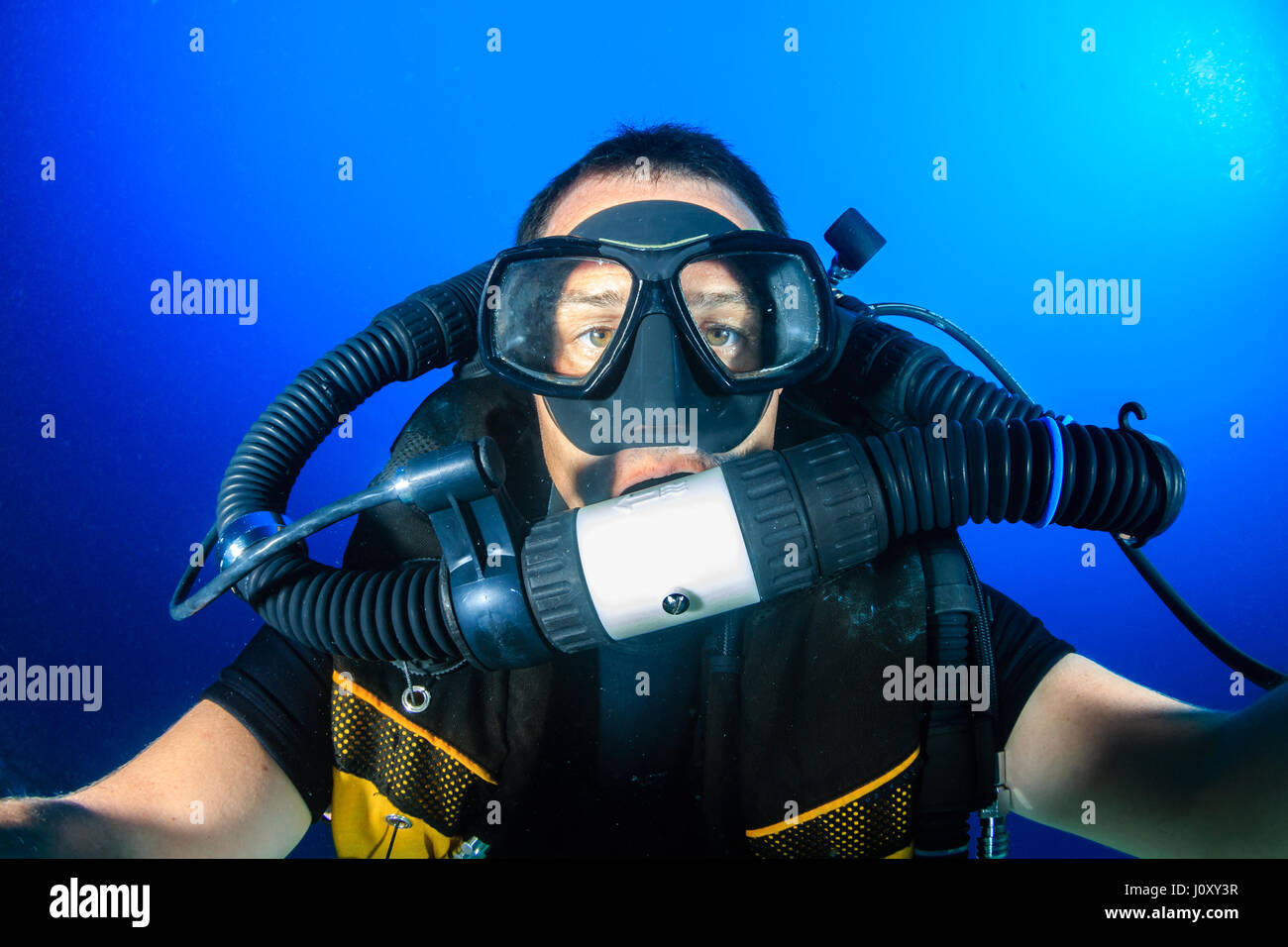 SCUBA diver on a Closed Circuit Rebreather in blue water Stock Photo