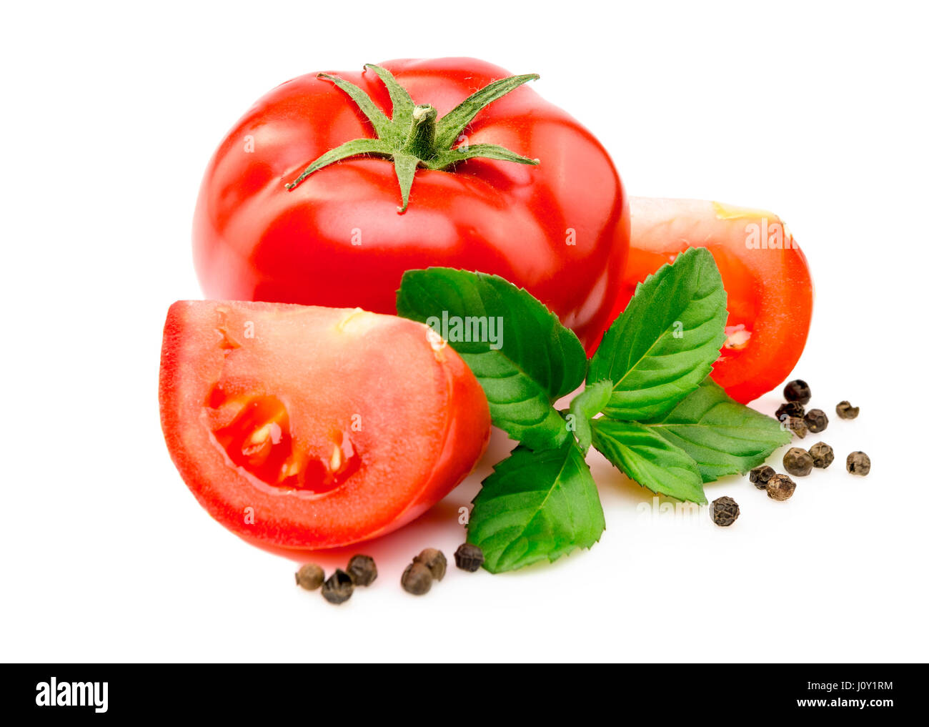 Tomatoes, basil leaves and black pepper on white background Stock Photo ...